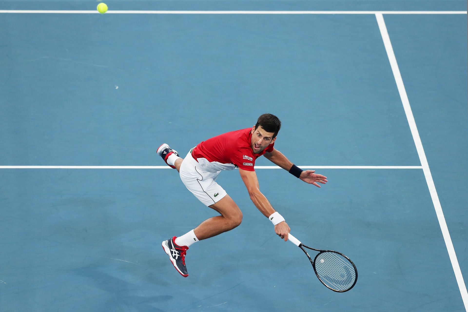 Novak Djokovic acrobatically plays a volley at the 2020 ATP Cup