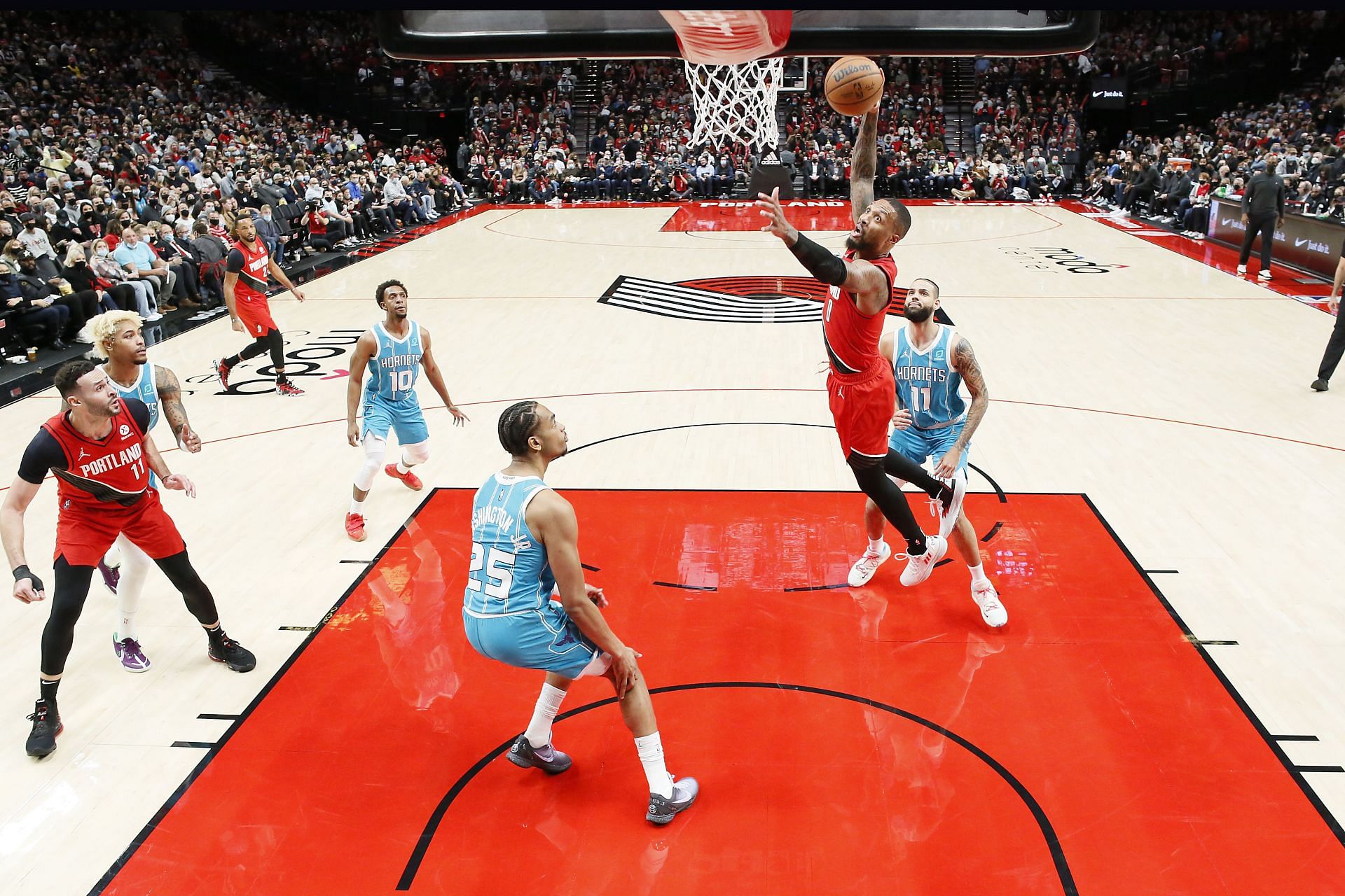 Damian Lillard goes up for a dunk against the Charlotte Hornets