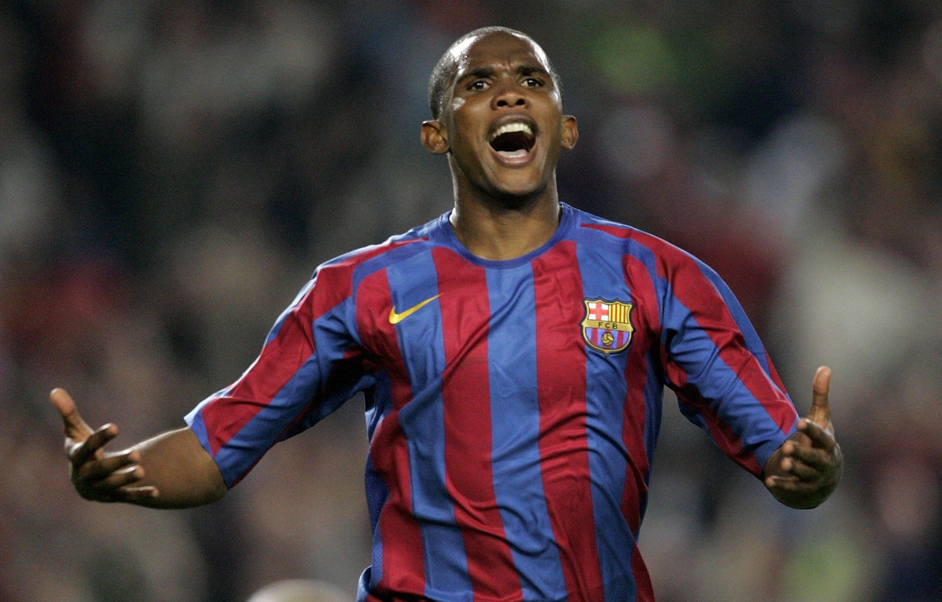 Samuel Eto&#039;o celebrating after scoring a goal for Barcelona