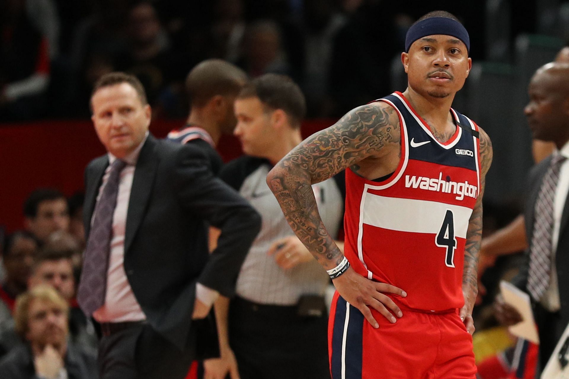 Isaiah Thomas #4 of the Washington Wizards (R) and Scott Brooks of the Washington Wizards look on against the Denver Nuggets during the second half at Capital One Arena on January 04, 2020 in Washington, DC.