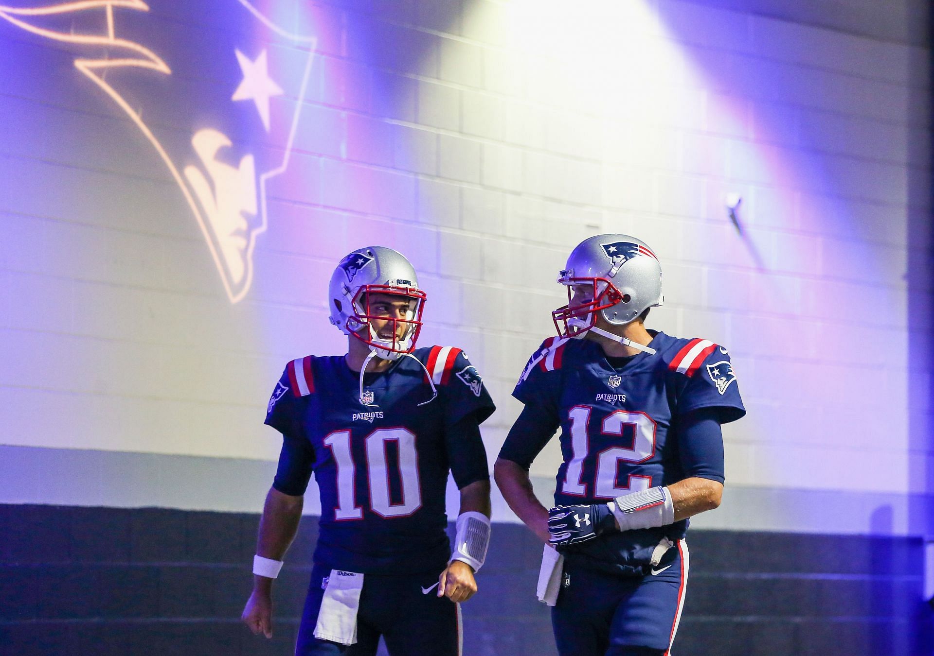 New England Patriots QB Jimmy Garoppolo (left), Tom Brady (right)