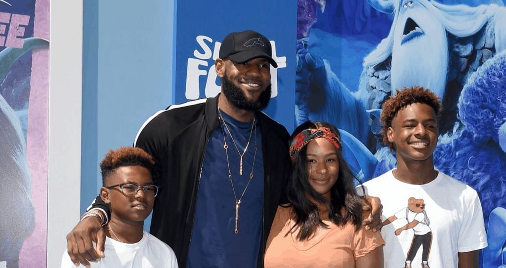 Bryce James (left) attends an event with LeBron James and the rest of the James family. [Source: Pro Sports Bio]