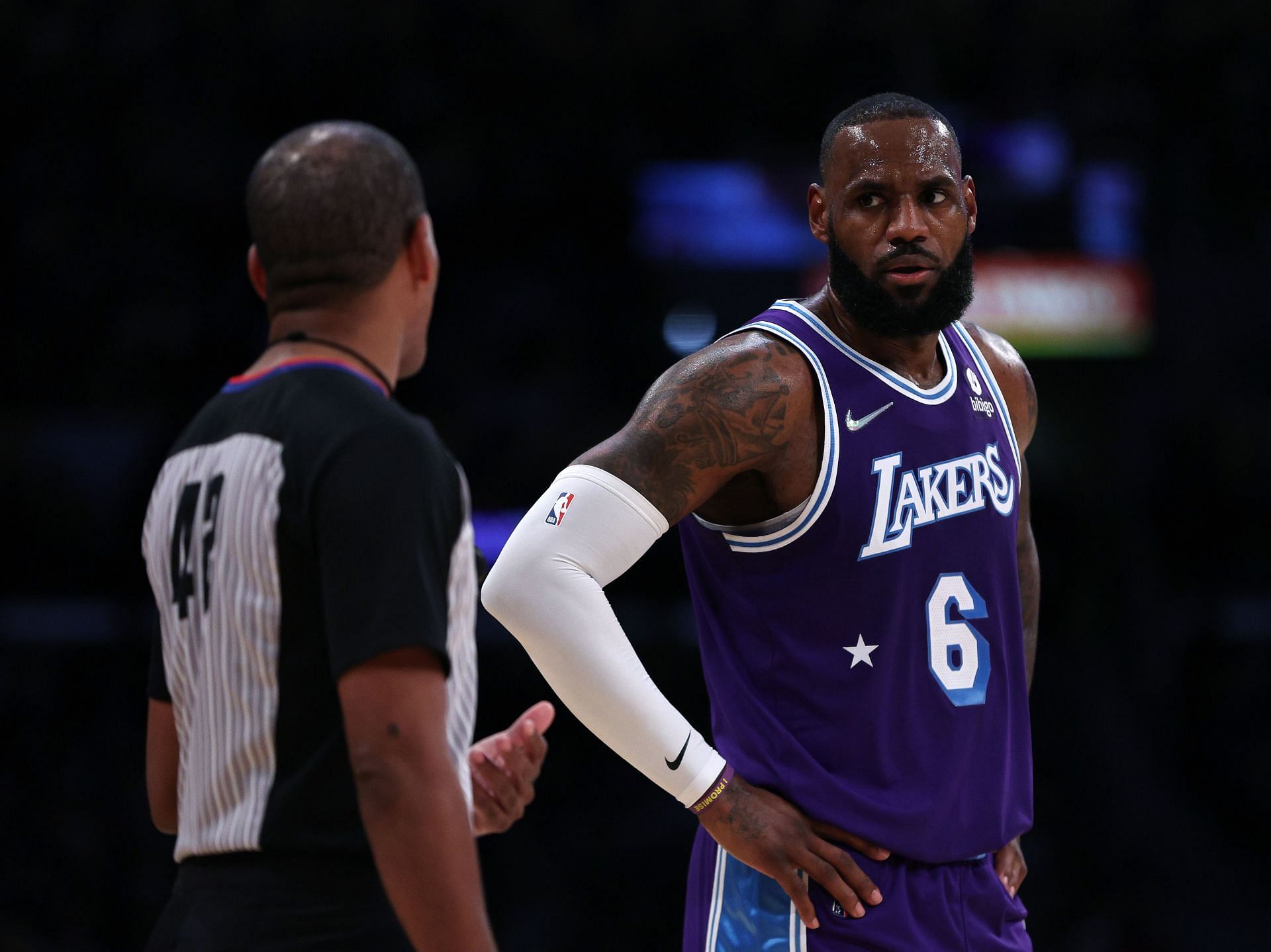 LeBron James of the LA Lakers talk with referee