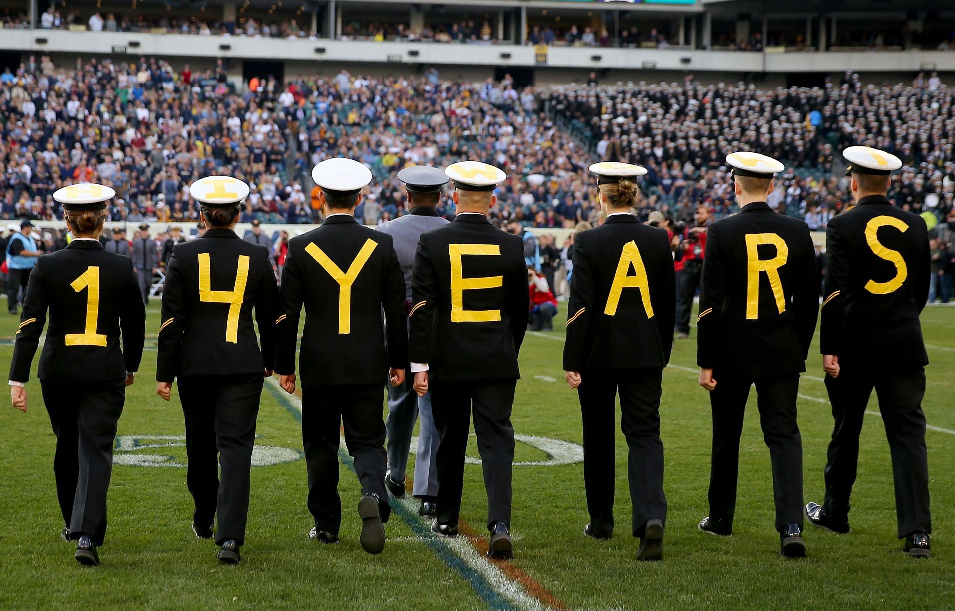 Midshipmen partaking in the 2016 exchange. Their message is a reference to their team&#039;s then-active 14-game winning streak in the Army-Navy Game (Photo: Getty)