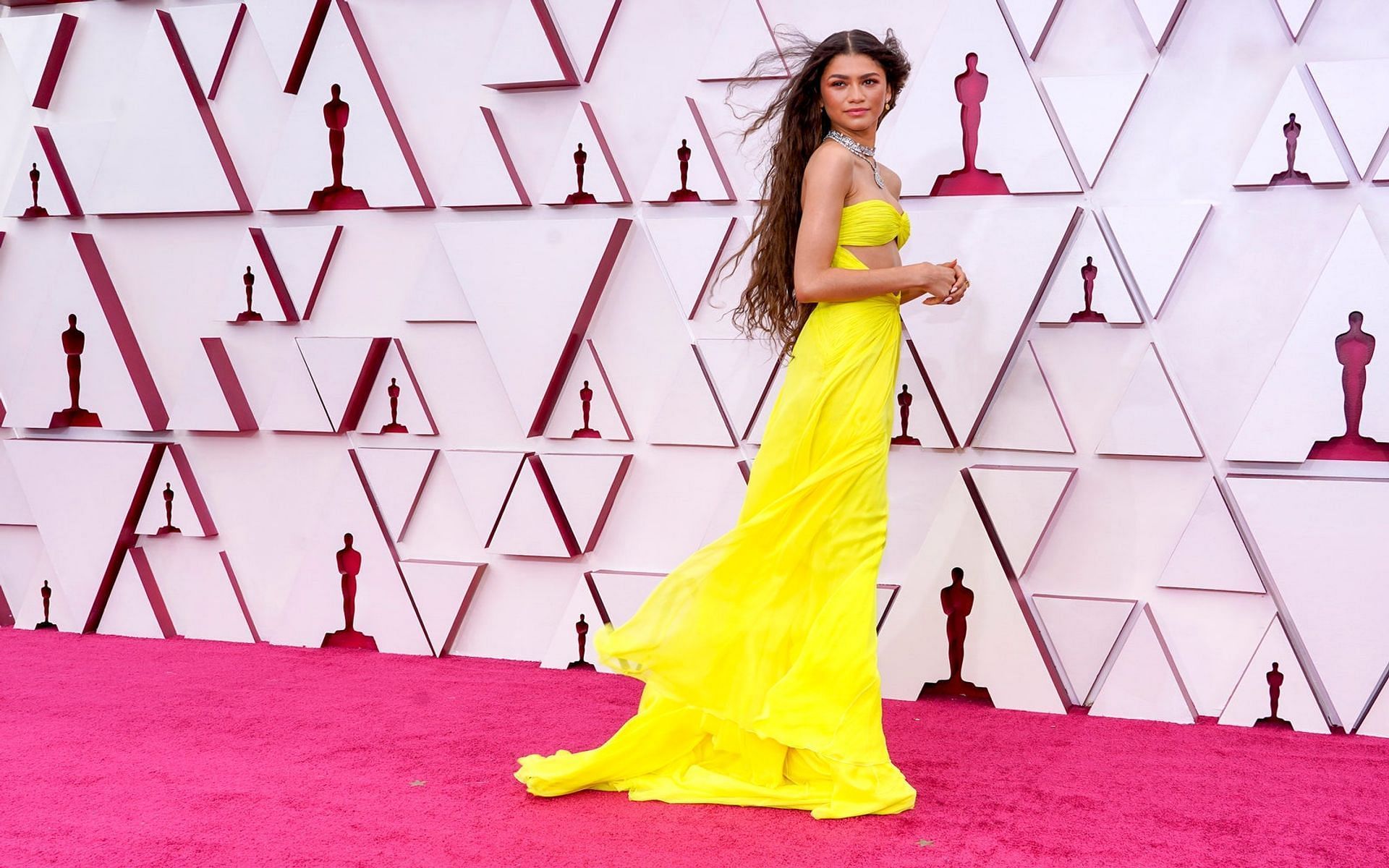 Zendaya in yellow chiffon Valentino dress at the 2021 Oscars (Image via Allure)