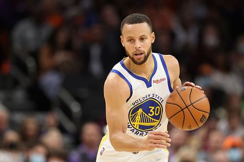 Steph Curry #30 of the Golden State Warriors handles the ball during the NBA game at Footprint Center on November 30, 2021 in Phoenix, Arizona. The Suns defeated the Warriors 104-96.