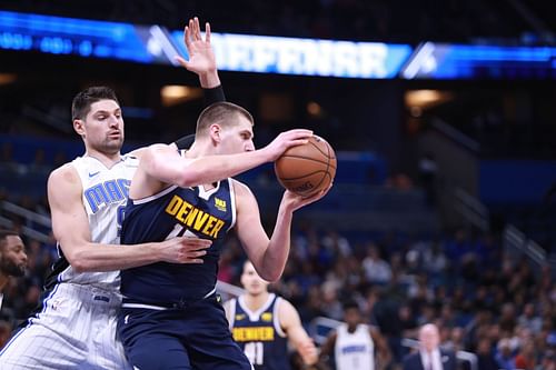 Nikola Vucevic (left) guards Nikola Jokic (right)