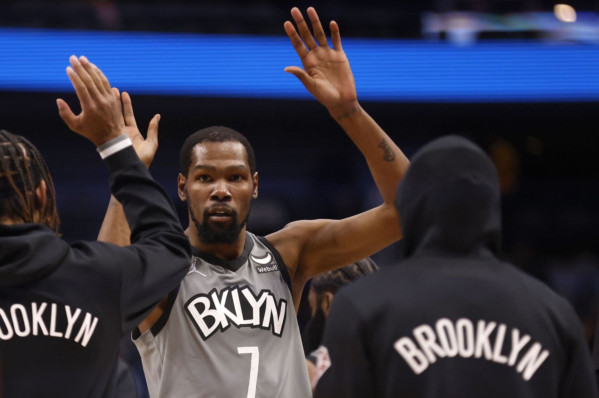 Kevin Durant celebrates a play as the Brooklyn Nets go into the huddle.