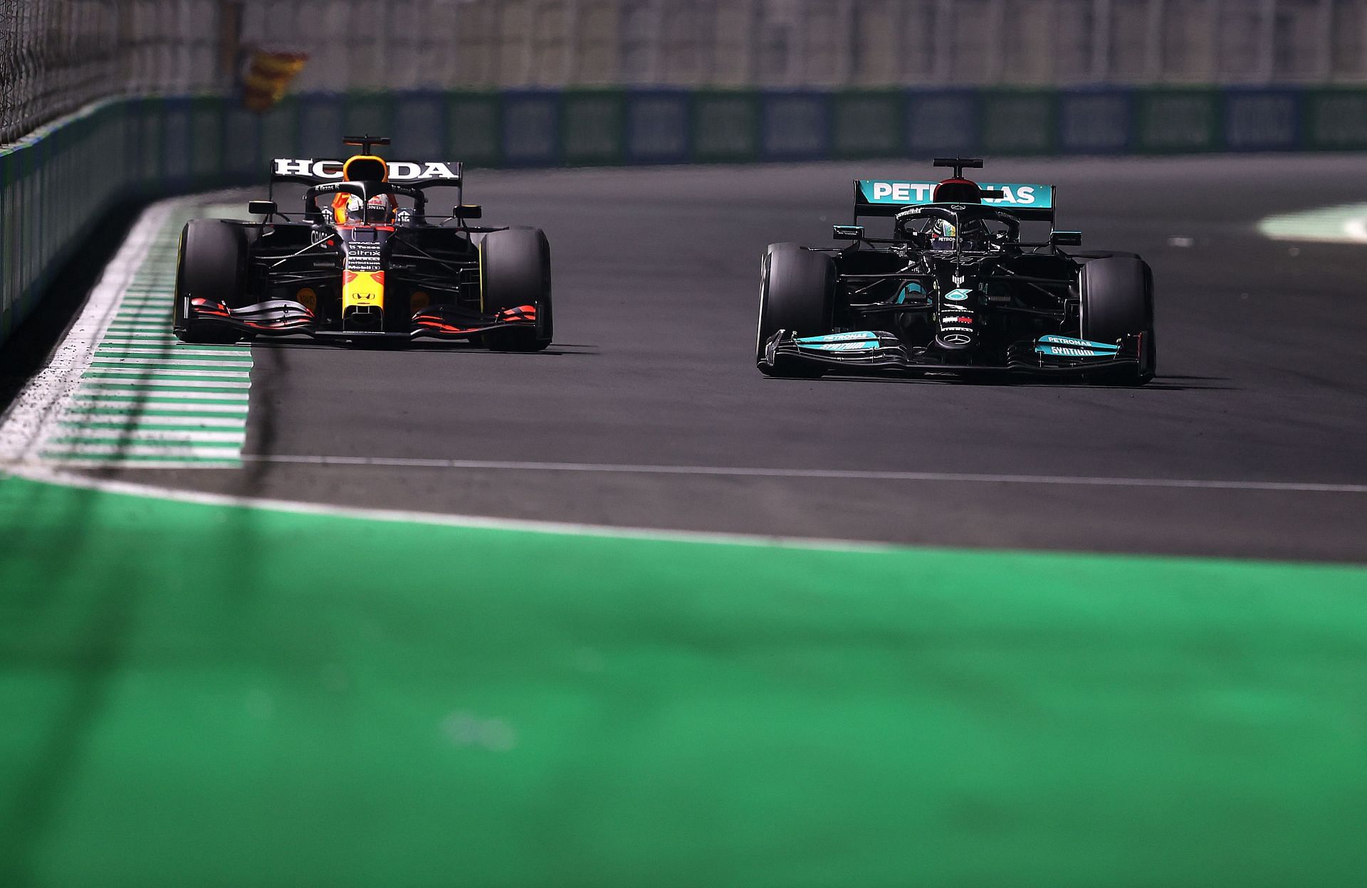 F1 Grand Prix of Saudi Arabia - Lewis Hamilton and Max Verstappen race towards a left-hander.