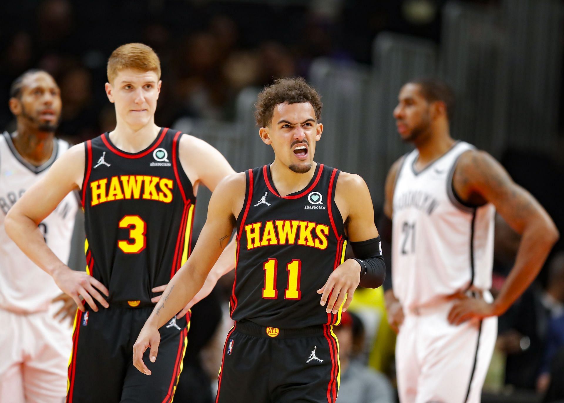 Trae Young (right) and Kevin Huerter of the Atlanta Hawks against the Brooklyn Nets