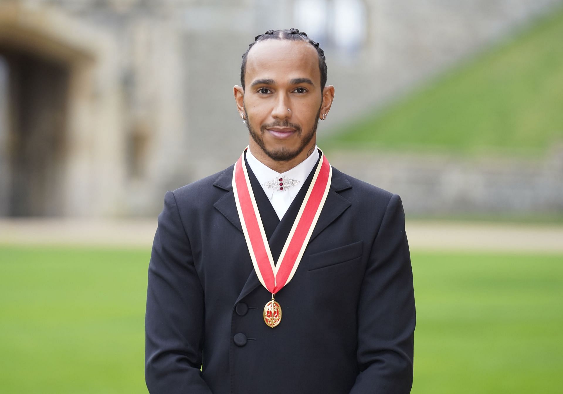 Sir Lewis Hamilton after he was made a Knight Bachelor by the Prince of Wales during a investiture ceremony at Windsor Castle on December 15, 2021 in Windsor, England. (Photo by Andrew Matthews - WPA Pool/Getty Images)