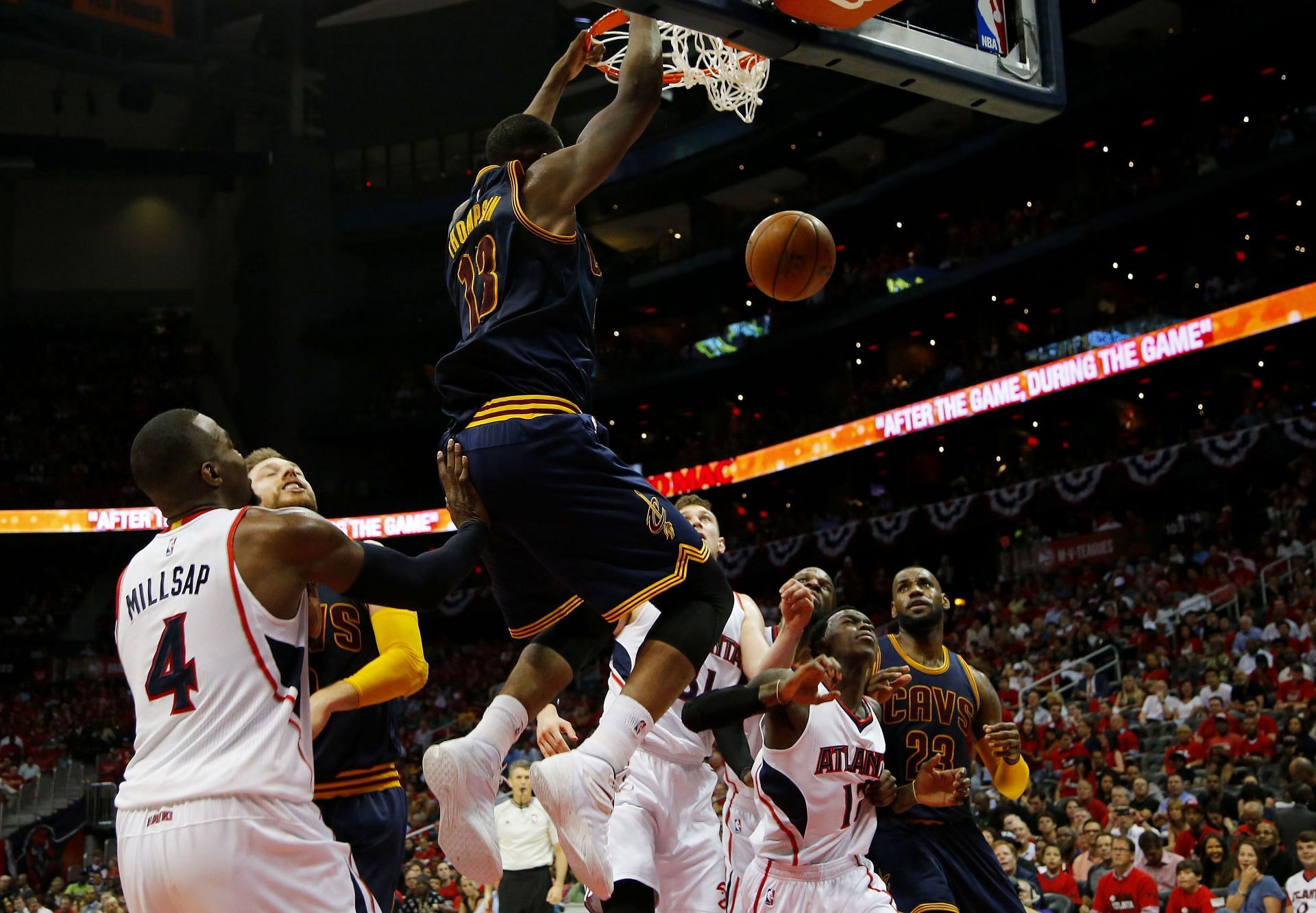 LeBron James of the Cleveland Cavaliers dunks against Paul Millsap of the Atlanta Hawks in the second quarter of Game One of the Eastern Conference finals on May 20, 2015, in Atlanta, Georgia.