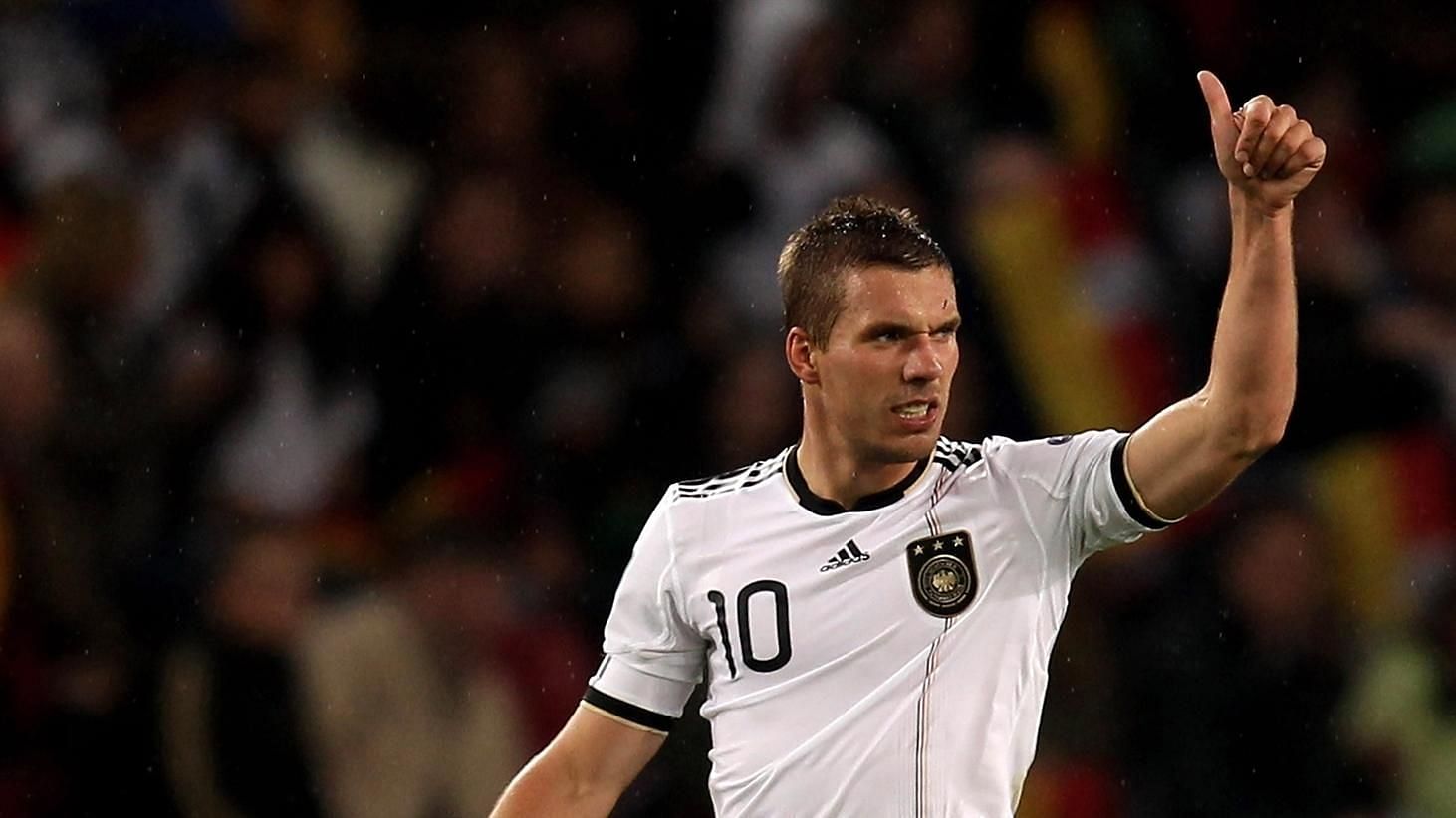 Lukas Podolski acknowledging a pass from a teammate during a game for Germany.