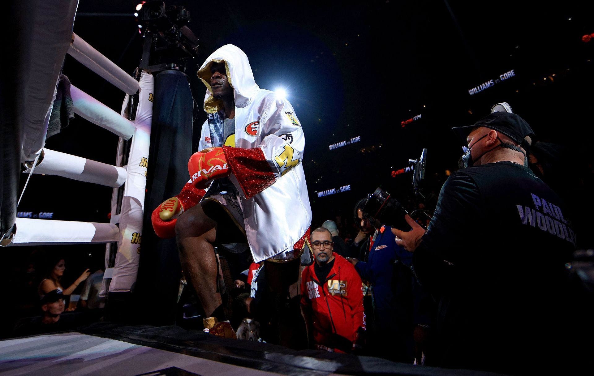 Frank Gore wears a San Francisco 49ers robe to MMA fight