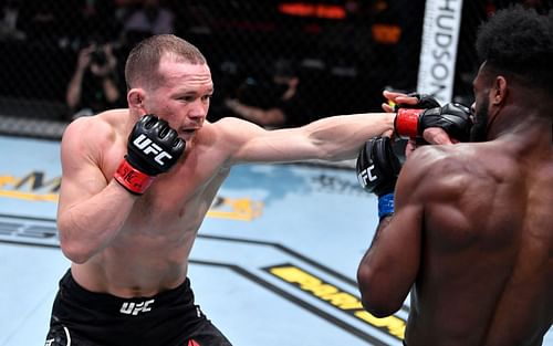 Petr Yan (left) in action against Aljamain Sterling (right) at UFC 259