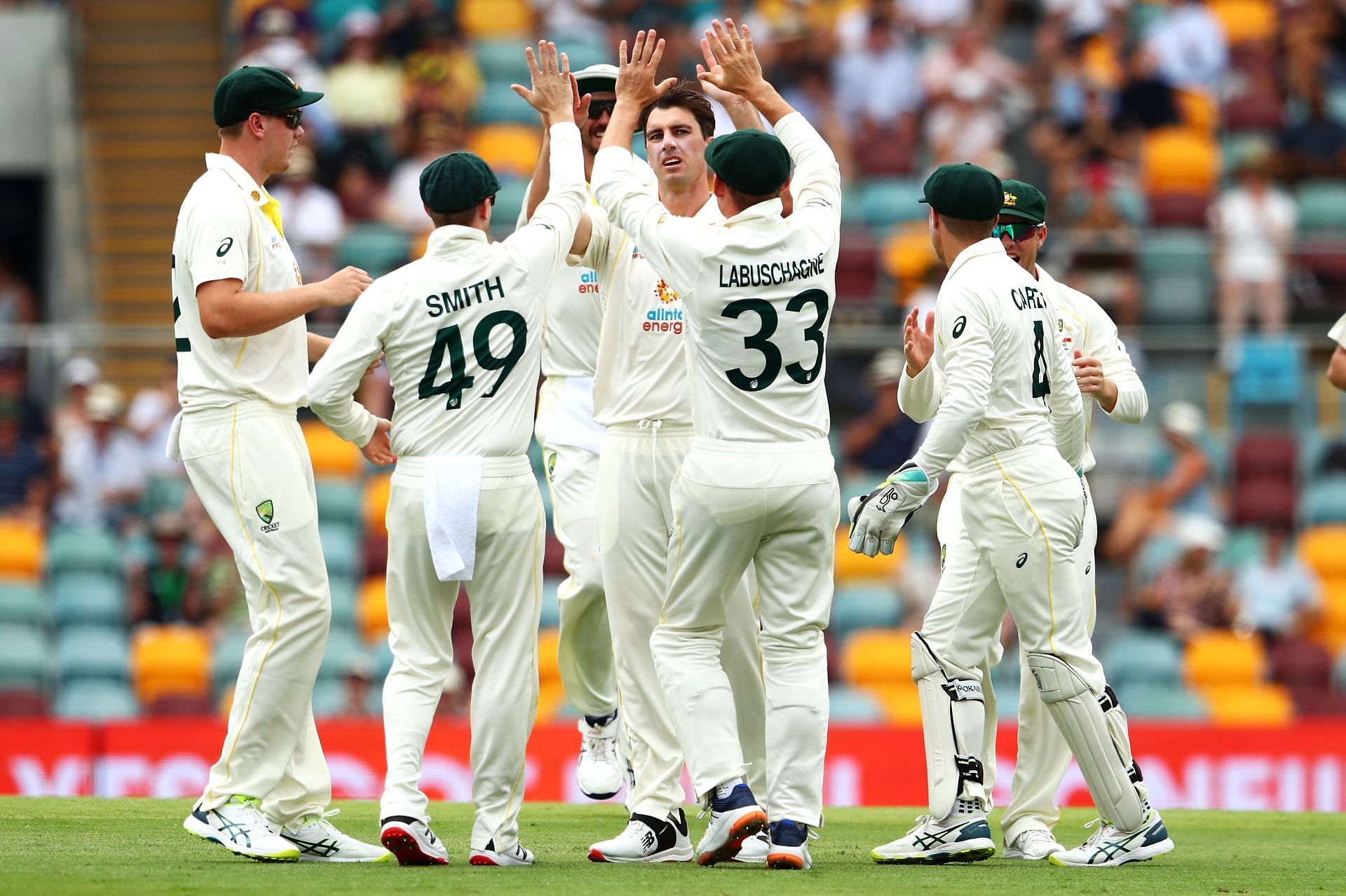 Pat Cummins celebrates with his team after taking the wicket of Rory Burns. Pic: Getty Images