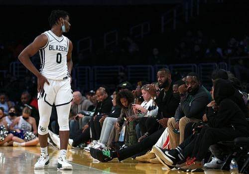 LeBron James, right, of the LA Lakers speaks to his son Bronny James (0) of Sierra Canyon