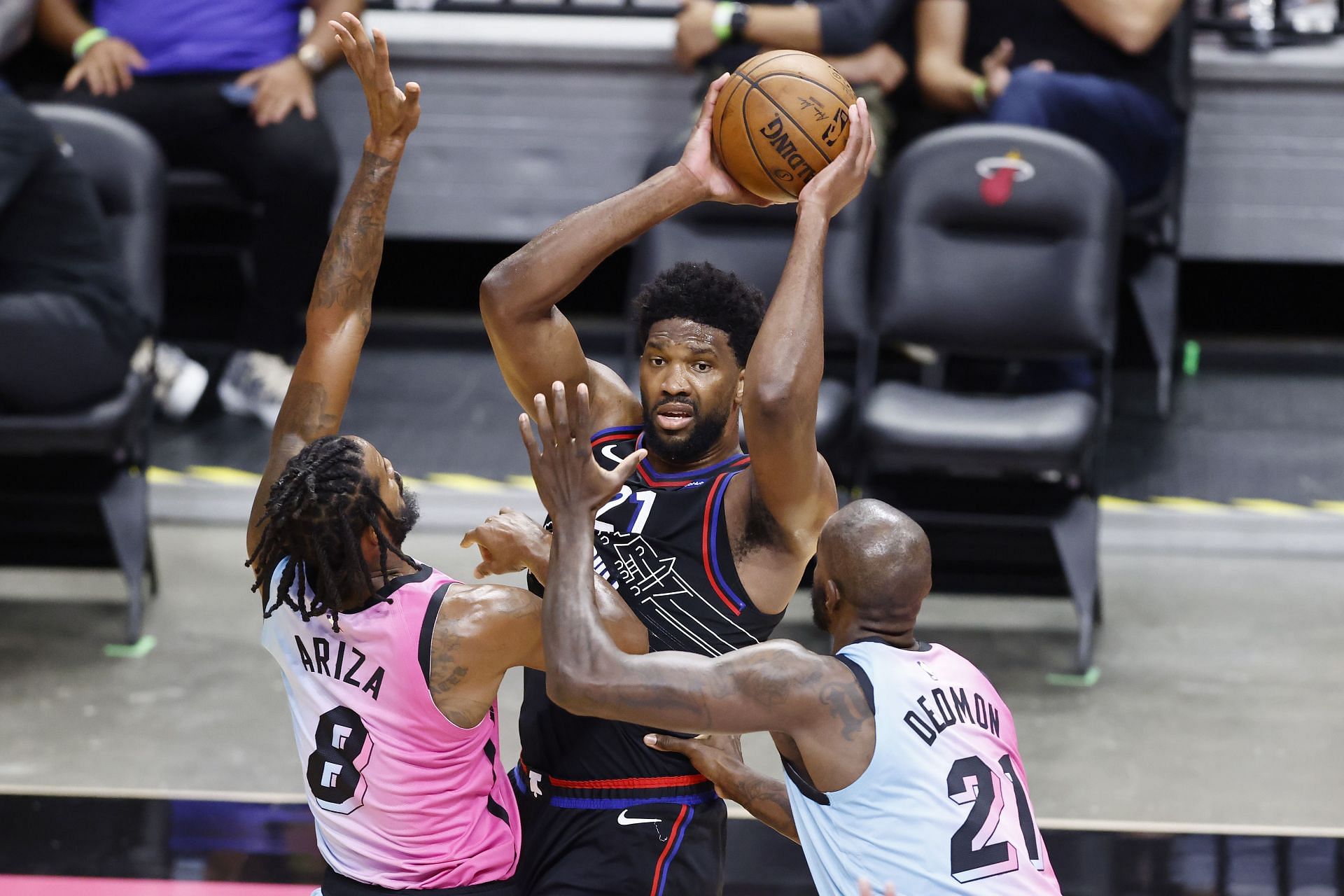 Joel Embiid #21 of the Philadelphia 76ers is defended by Trevor Ariza #8 and Dewayne Dedmon #21 of the Miami Heat during the first quarter at American Airlines Arena on May 13, 2021 in Miami, Florida.