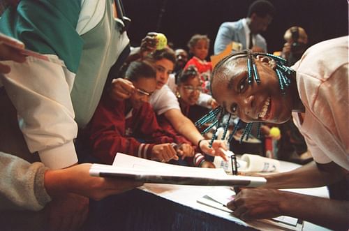 Venus Williams signing autographs following her very first career win