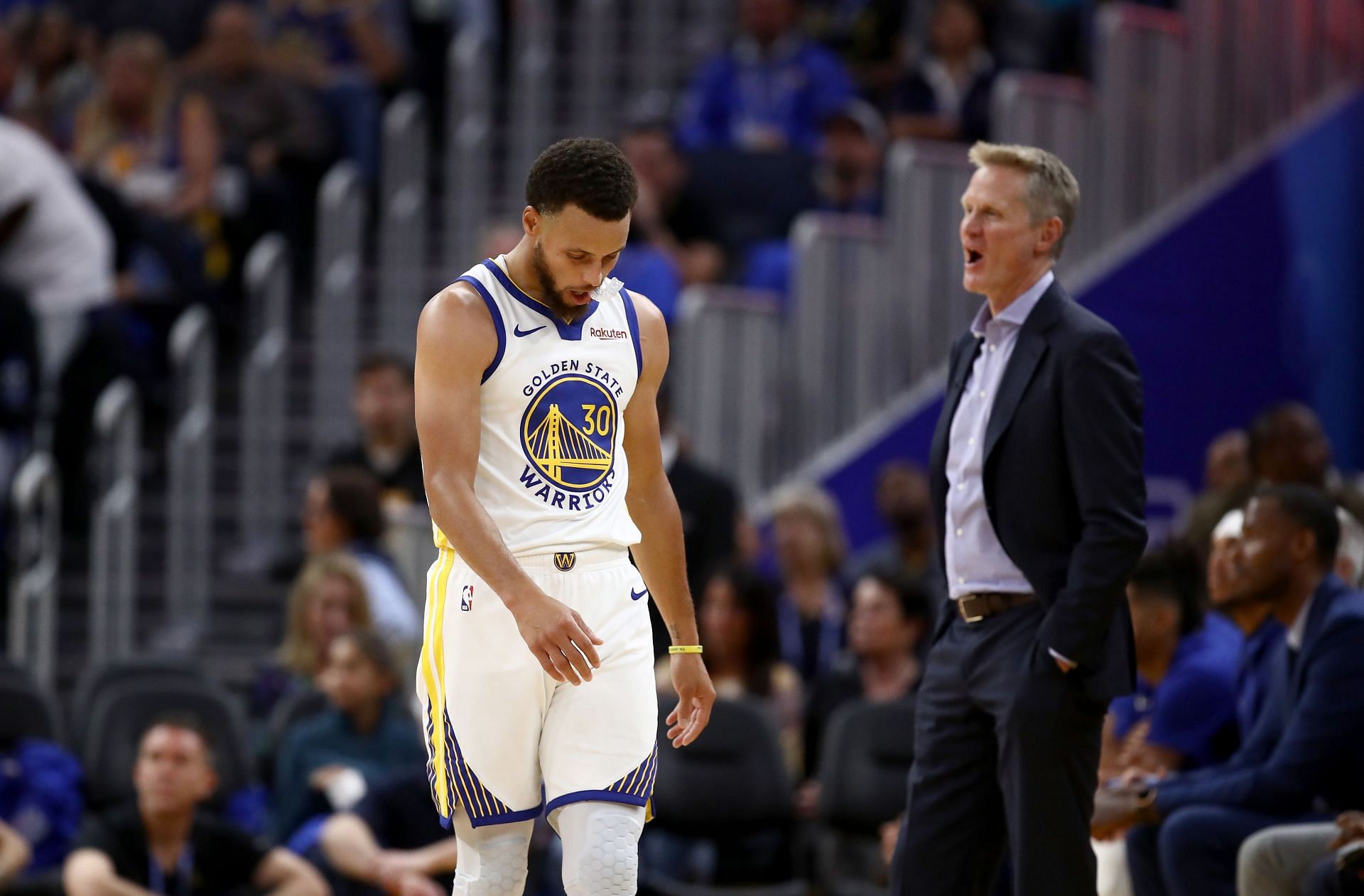 Steve Kerr pulls Steph Curry from the court at a Golden State Warriors game