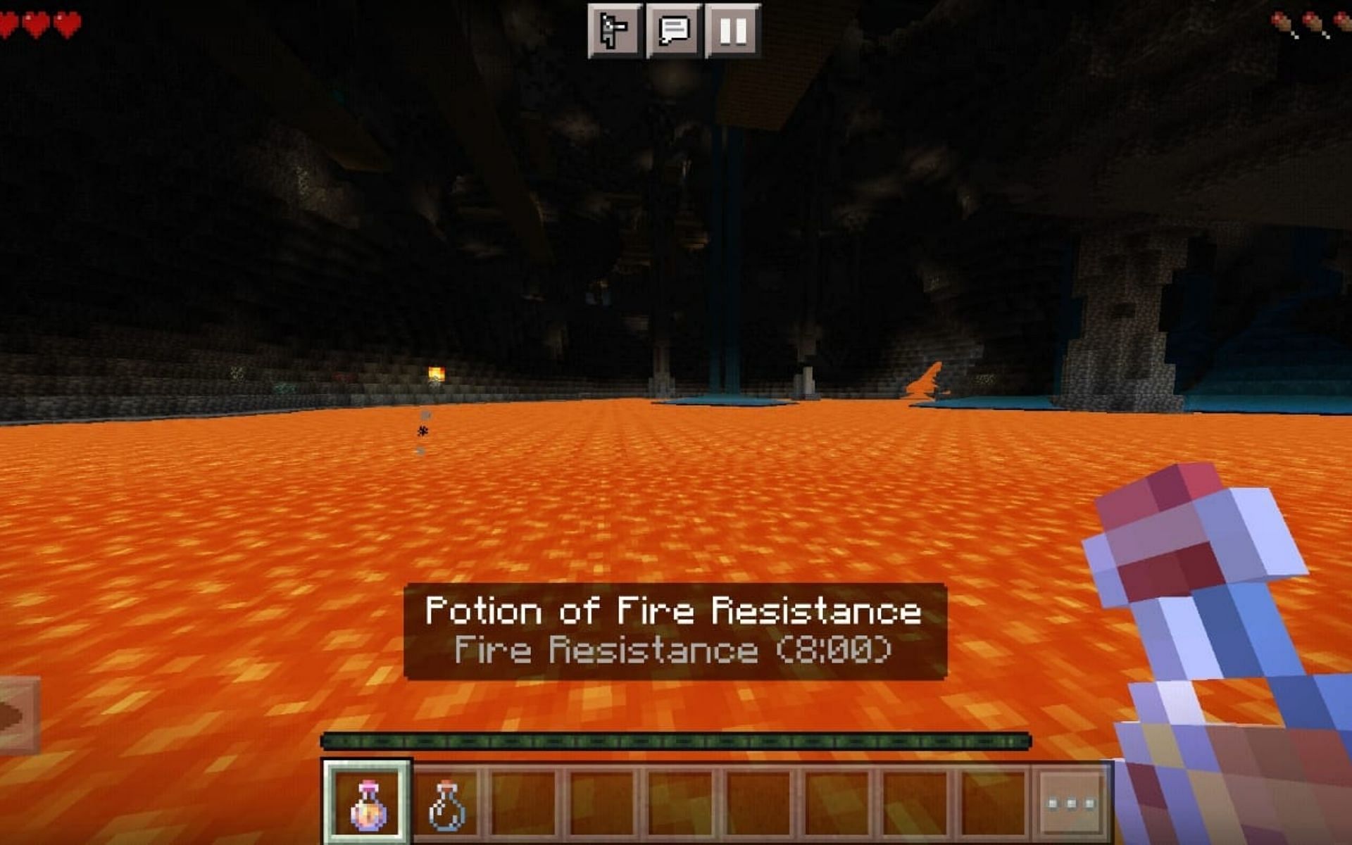 Fire resistance makes the player immune to lava (Image via Minecraft)