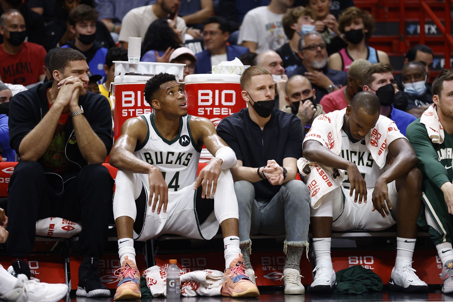 Donte DiVincenzo and Brook Lopez of the Milwaukee Bucks on the bench alongside Giannis Antetokounmpo and Khris Middleton