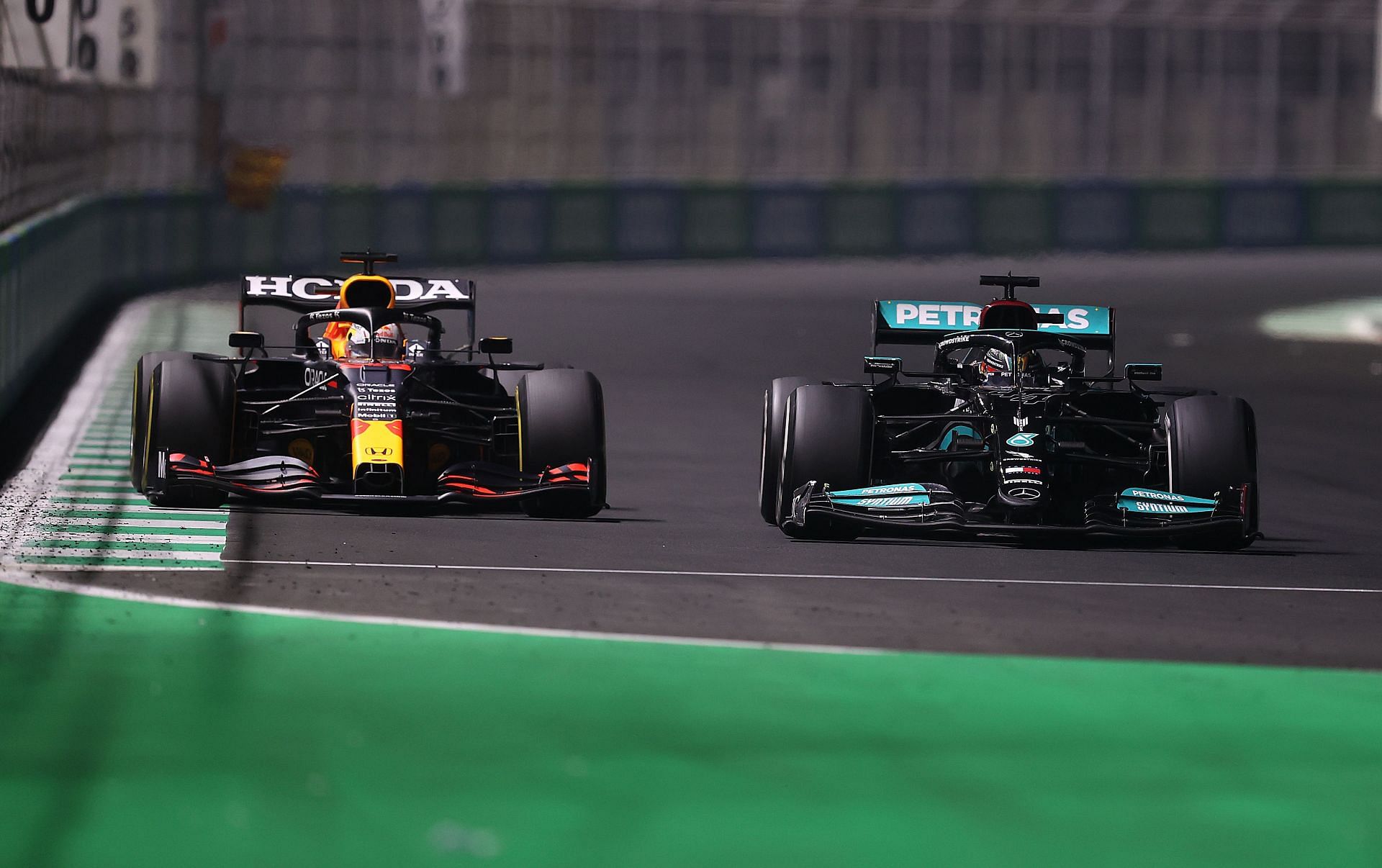 Max Verstappen and Lewis Hamilton locked in an intense battle at the Saudi Arabian Grand Prix in Jeddah. (Photo by Lars Baron/Getty Images)
