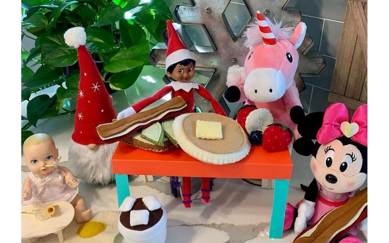 Bean, The Elf on the Shelf, in a wheelchair (Image via StrongLikeStella/Instagram)