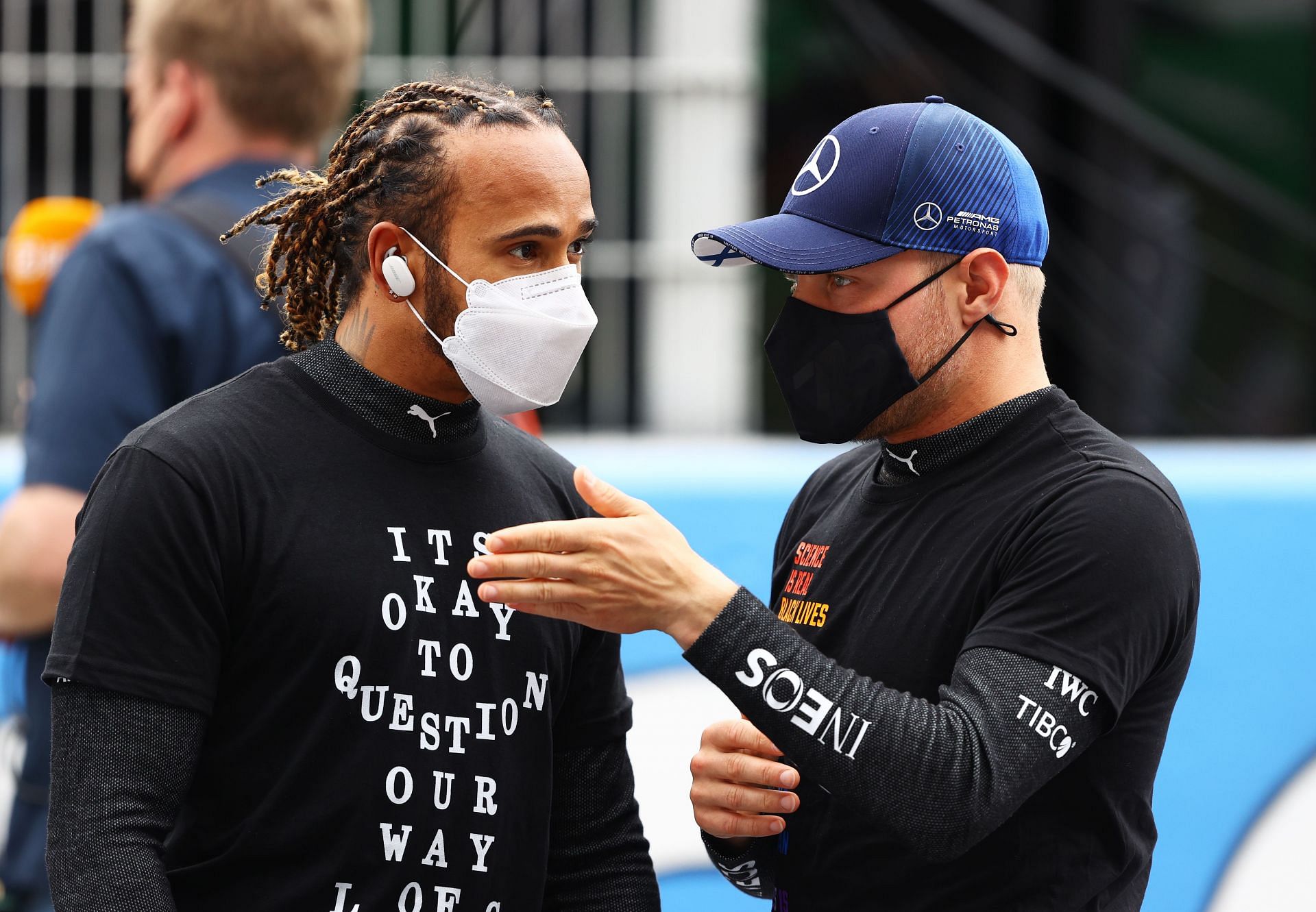 Lewis Hamilton (left) and Valtteri Bottas (right) have a chat before the 2021 Spanish Grand Prix.