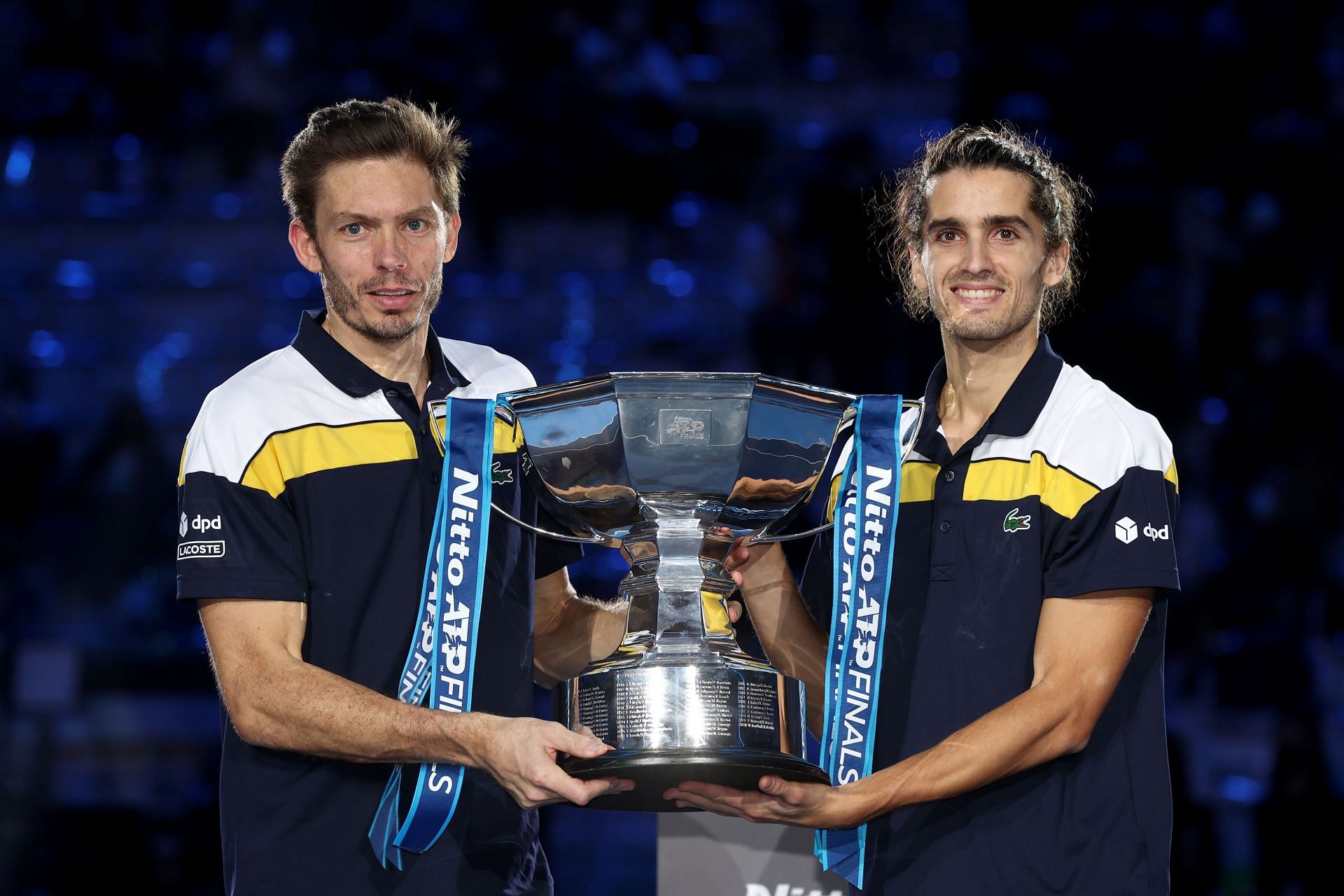 Nicolas Mahut and Pierre-Hugues Herbert celebrate after winning the 2021 Nitto ATP World Tour Finals