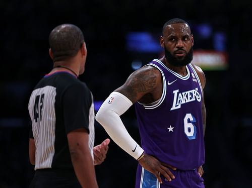 The LA Lakers' LeBron James talks to the referee during their game against the LA Clippers