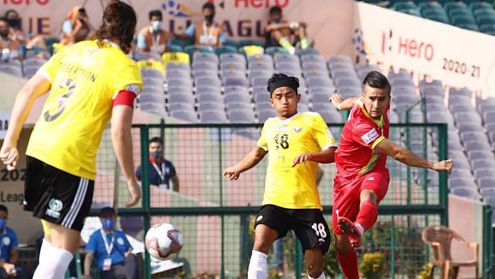 Komron Tursunov (in red) in action for TRAU FC