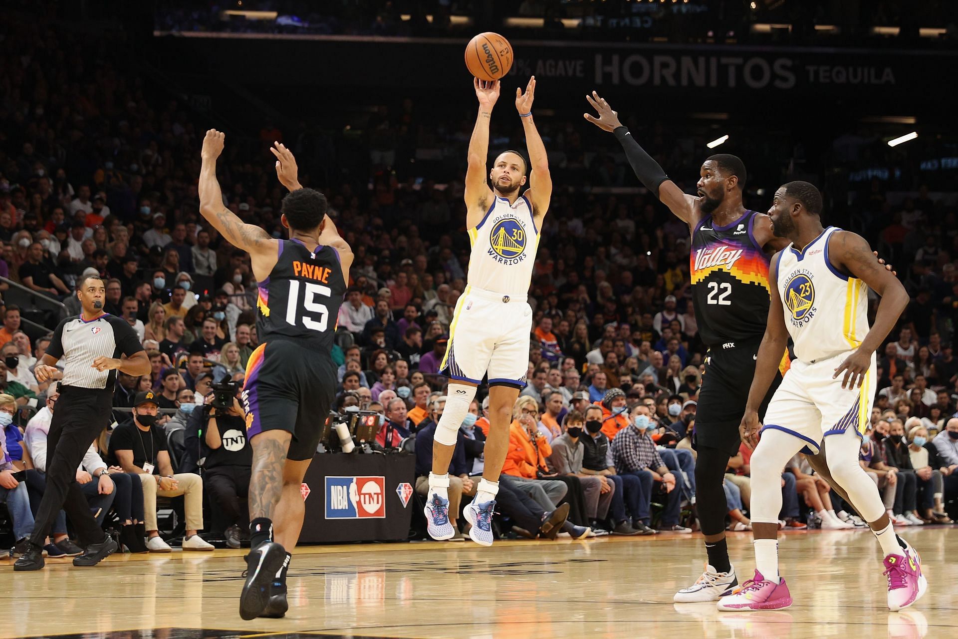 Steph Curry attempts a jump shot against the Phoenix Suns