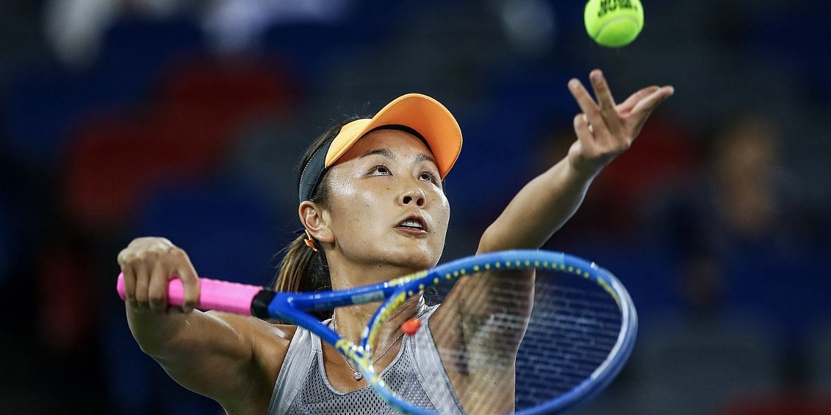 Peng Shuai in the act of serving