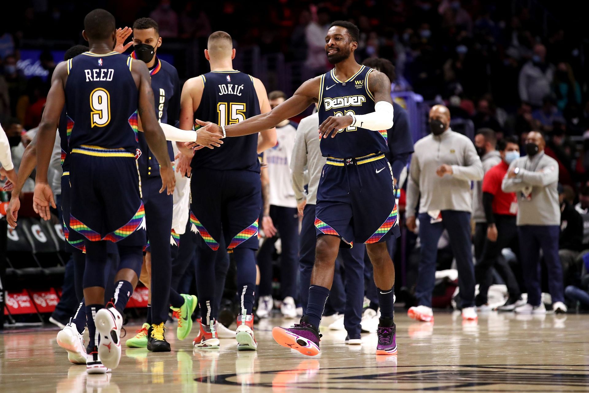 Nikola Jokic of the Denver Nuggets with his teammates