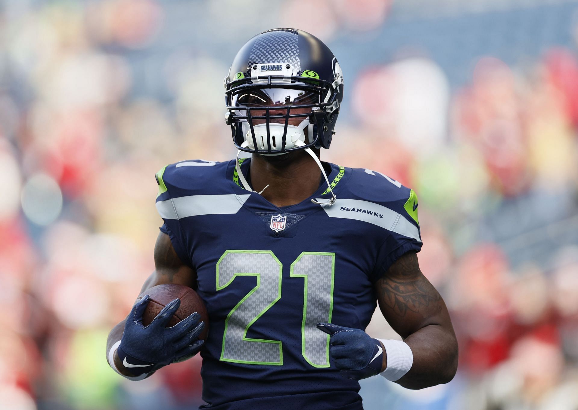 Seattle Seahawks players pose with their Super Bowl rings