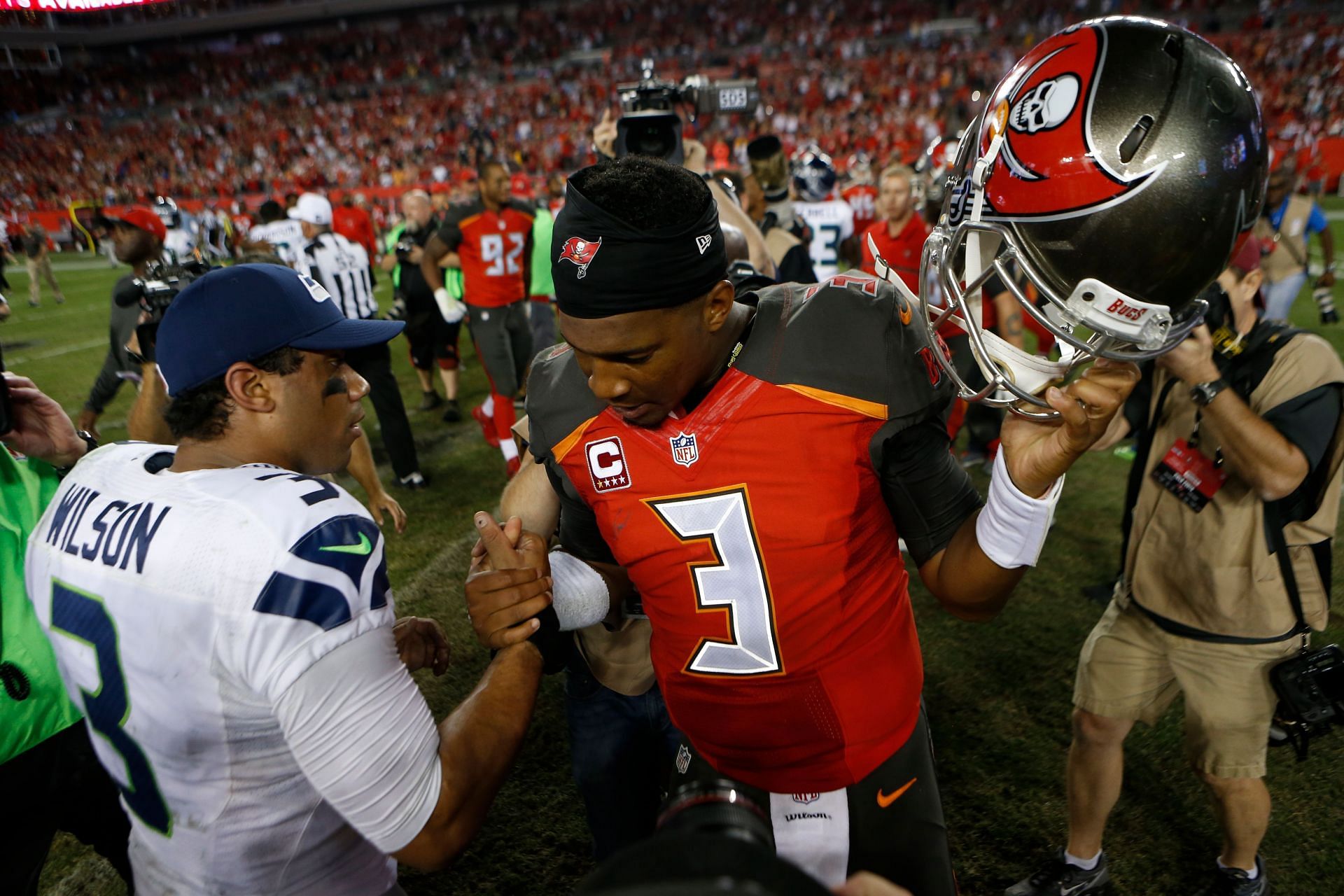 Jameis Winston (in red) could be one of the potential solutions at quarterback if Russell Wilson (in white) leaves the Seahawks (Photo: Getty)