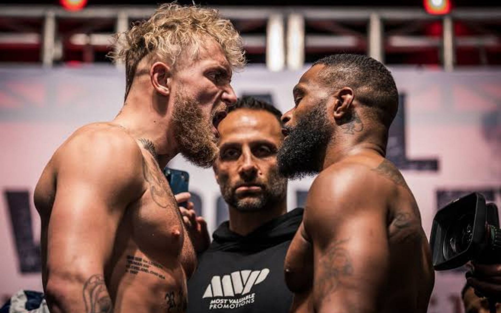 Jake Paul (left) Tyron Woodley (right) facing off before their fight