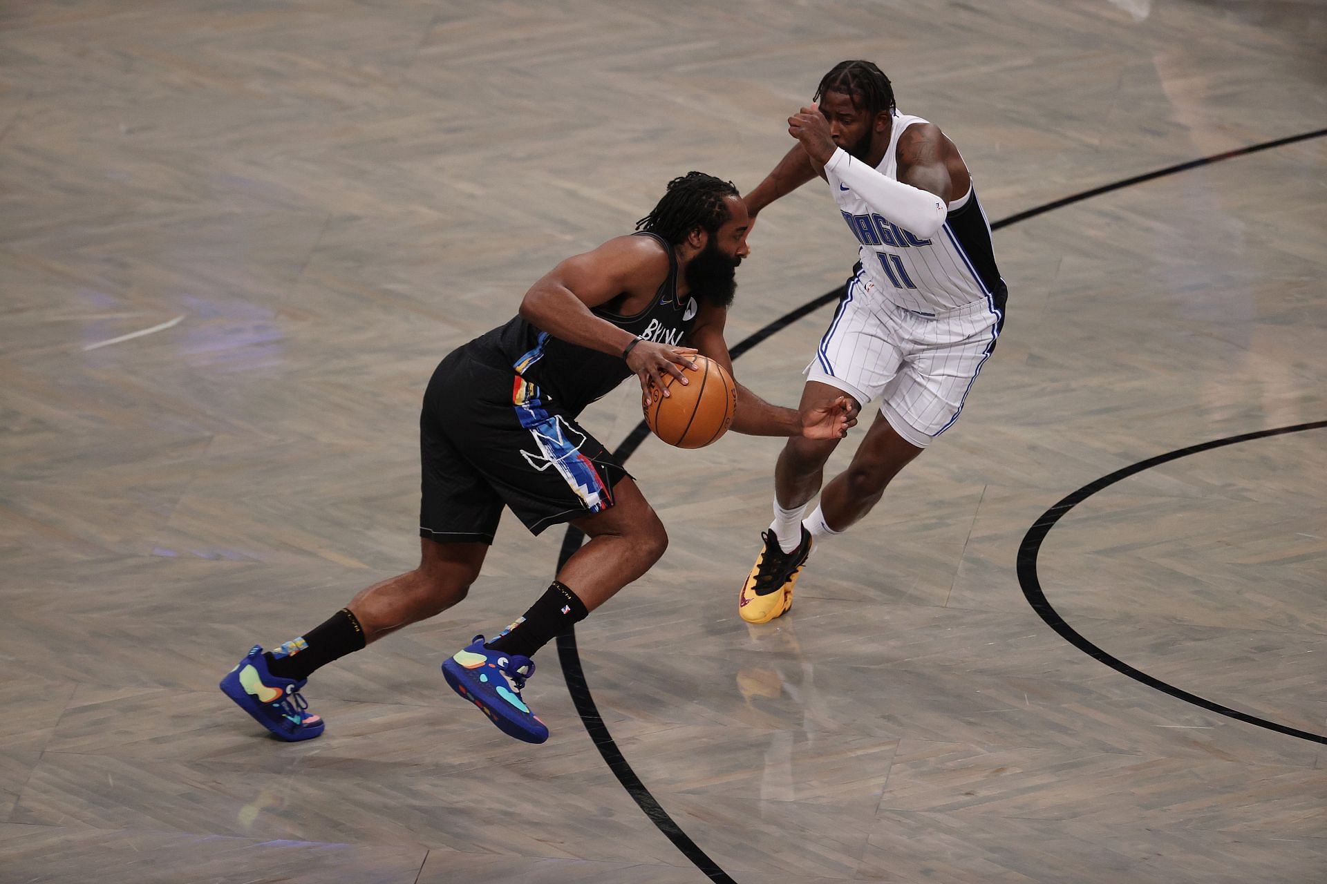 James Ennis III guards James Harden of the Brooklyn Nets