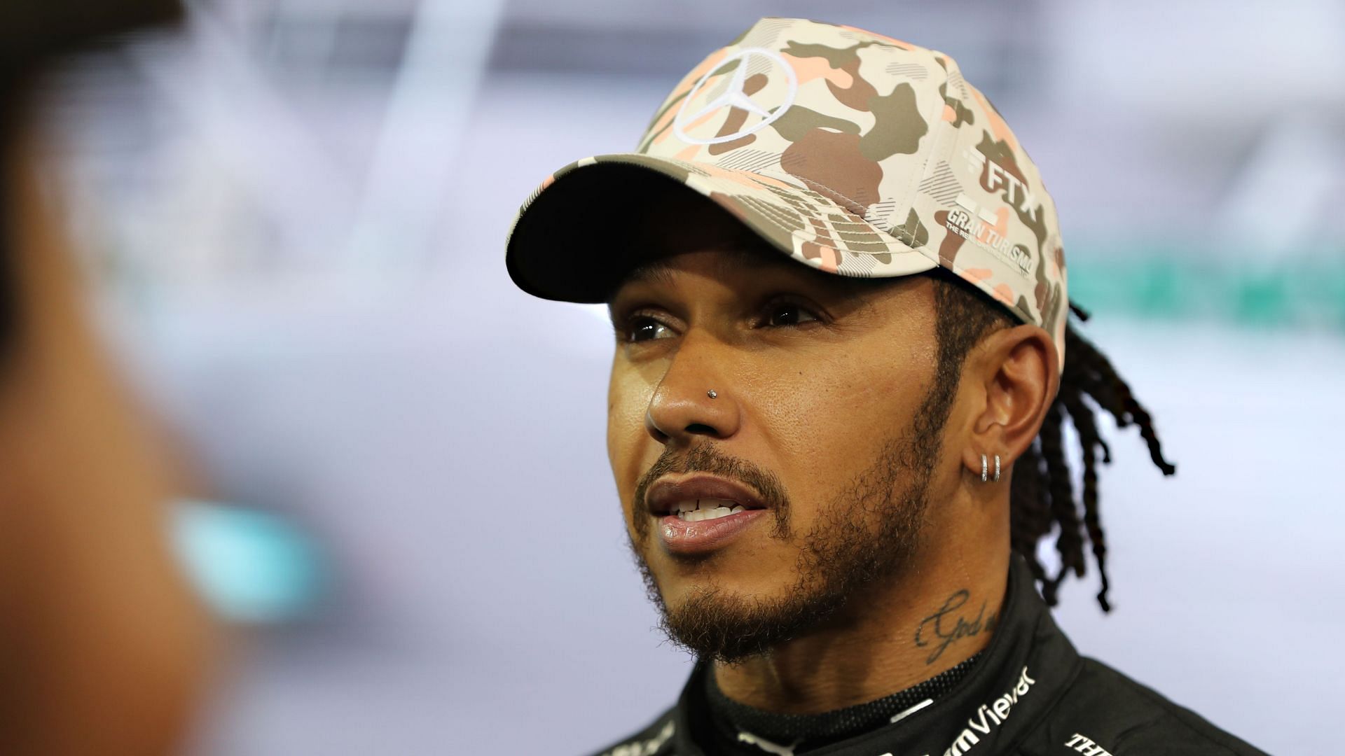 Lewis Hamilton o looks on in parc ferme during qualifying ahead of the 2021 Abu Dhabi GP. (Photo by Kamran Jebreili - Pool/Getty Images)