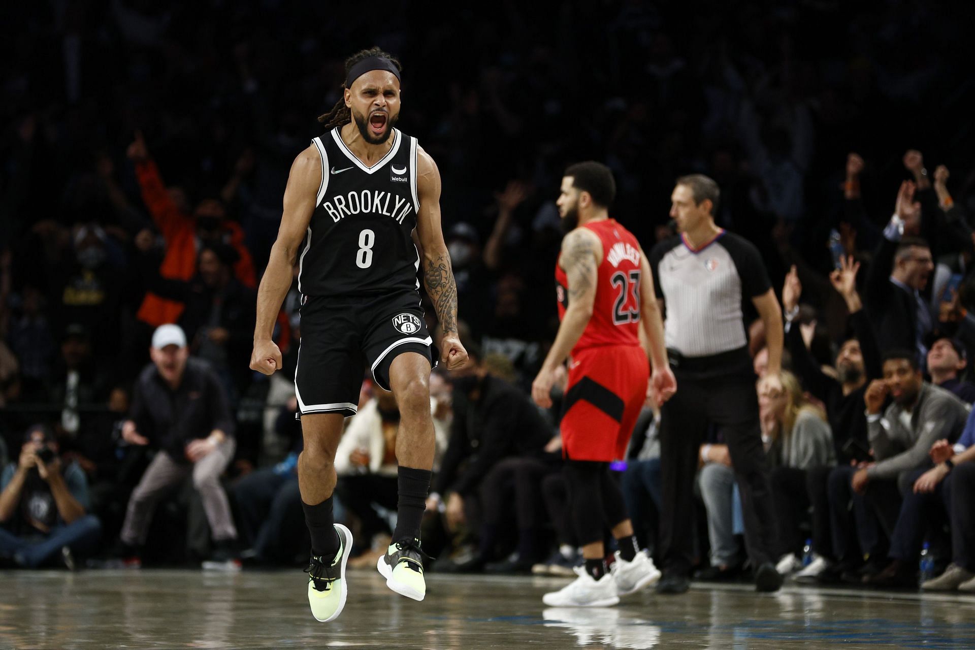 Patty Mills celebrates after hitting a clutch three.