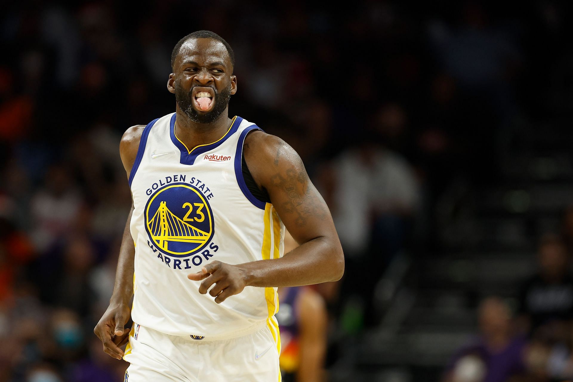 Draymond Green #23 of the Golden State Warriors reacts after a three-point shot against the Phoenix Suns during the second half of NBA game at Footprint Center on December 25, 2021 in Phoenix, Arizona. The Warriors defeated the Suns 116-107.