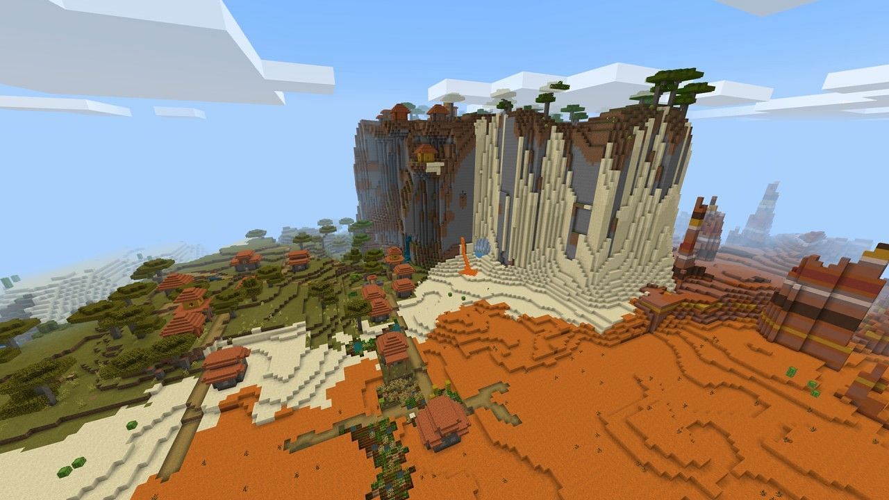 The cliff overlooks beautiful biomes in this seed (Image via Minecraft)