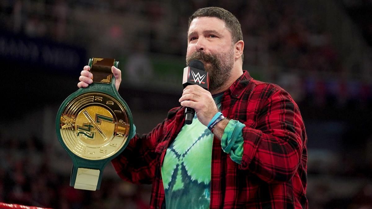 Mick Foley showcasing the WWE 24/7 Championship