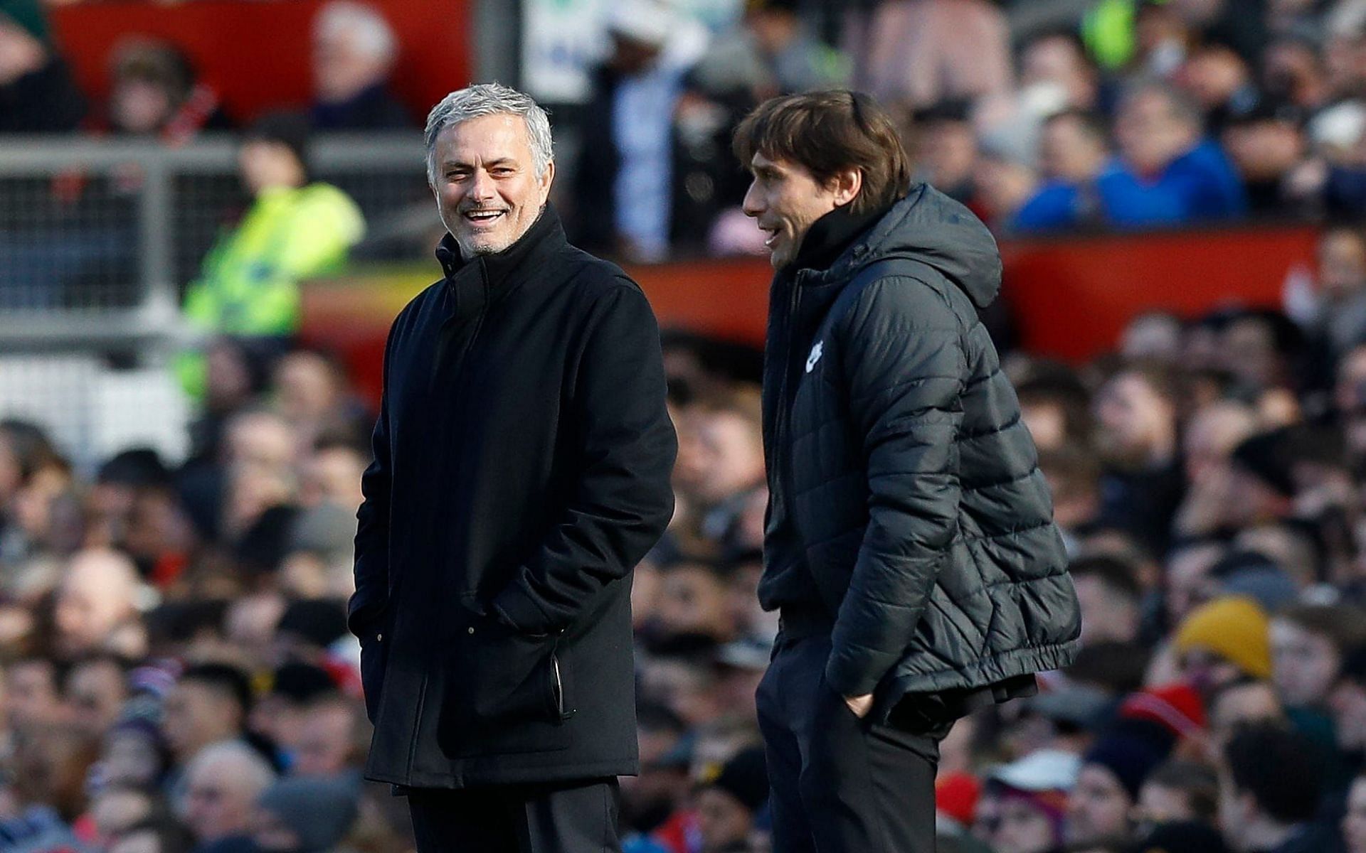 Jose Mourinho (left) and Antonio Conte share a rare laugh.