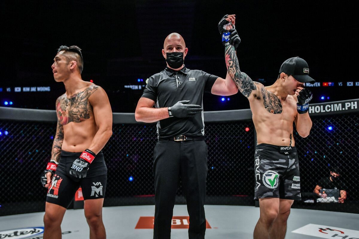 A dejected Martin Nguyen (Left) and an emotional Kim Jae Woong (Right) as the official result was announced. | [Photo: ONE Championship]