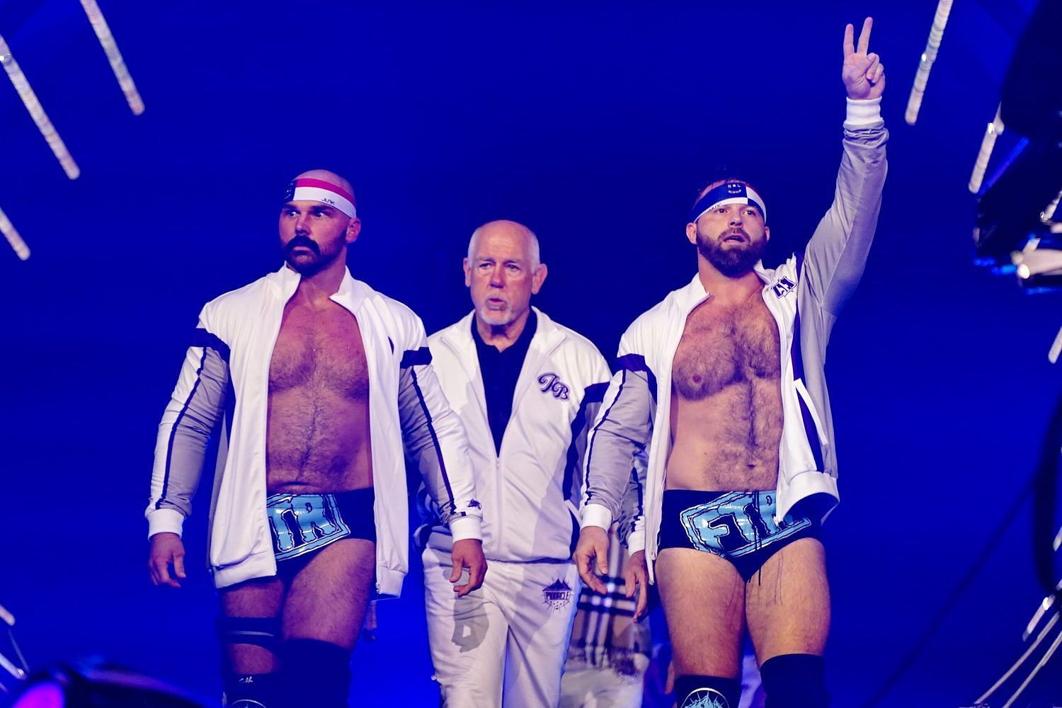 FTR making their AEW entrance with Tully Blanchard