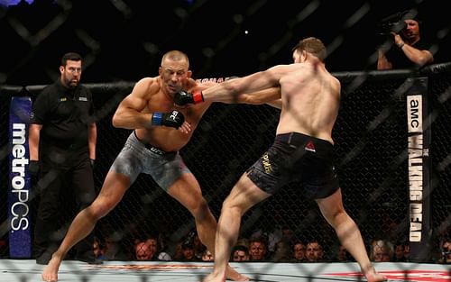 John McCarthy, Georges St-Pierre, Michael Bisping [Images via Getty: UFC 217: Bisping v St-Pierre]