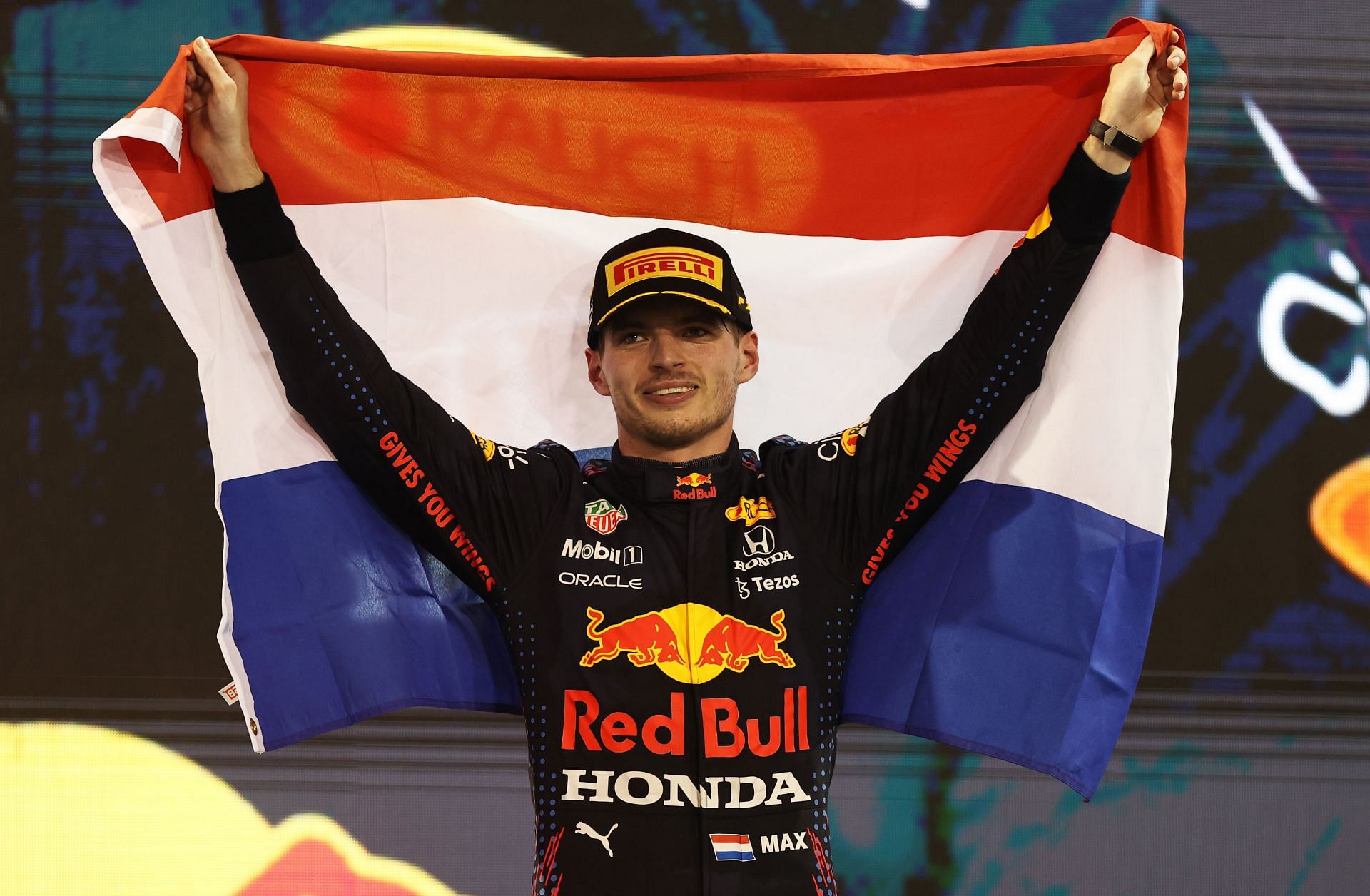 F1 Grand Prix of Abu Dhabi - Max Verstappen hoists the Dutch flag after winning the race