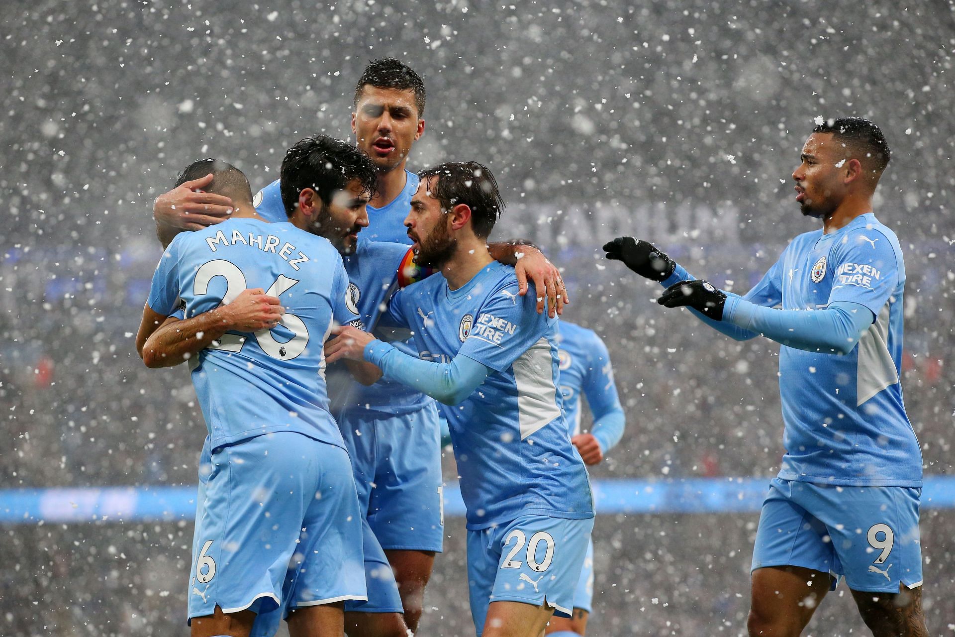 Manchester City players celebrate a goal.